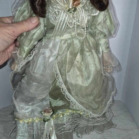 Heirloom Treasure Doll, Dark Long Curley Hair with Green Dress and Bow on Front - Picture 4 of 10